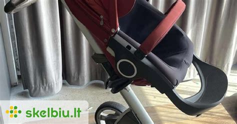 Stokke vežimėlis su kūdikiu