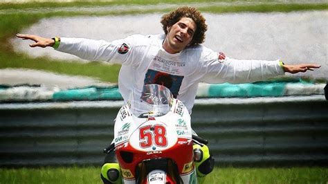 Marco Simoncelli celebrating his 250cc World Championship win