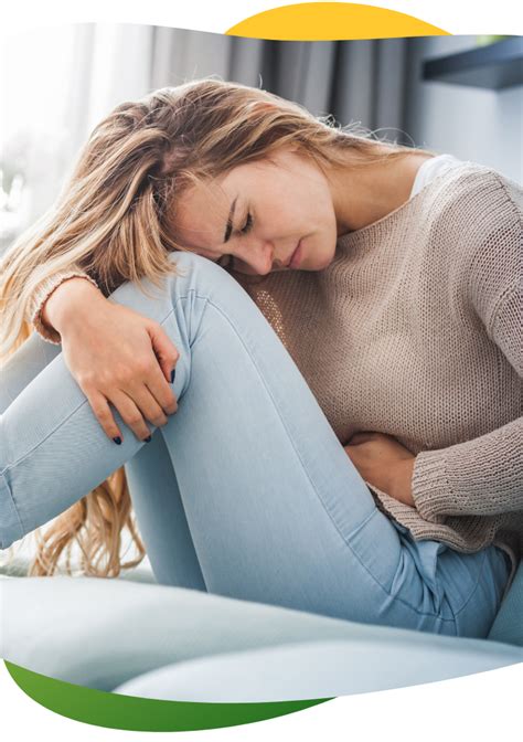 Simbolinis vaizdas: moteris, laikanti rankas ant pilvo, su susirūpinusiu veidu