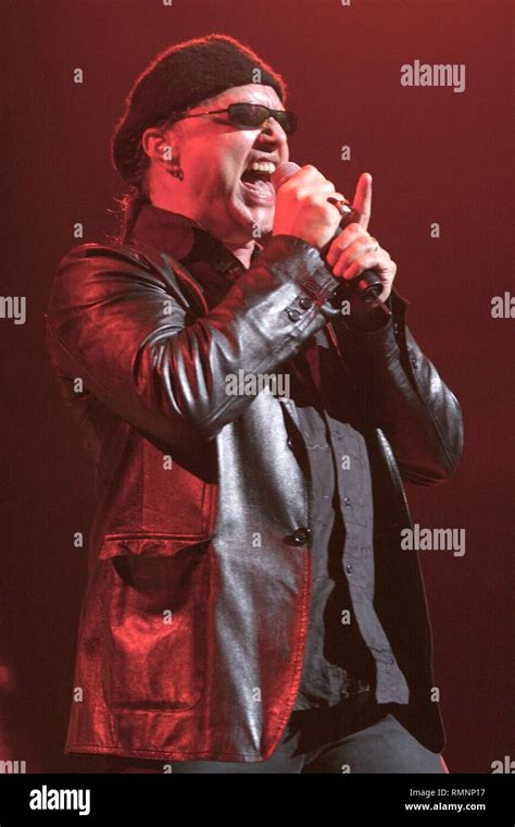 Geoff Tate performing on stage