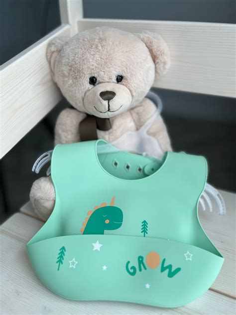 Vaikiškas seilinukas su jūros arkliuko motyvu